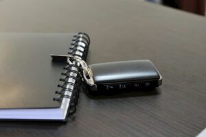 Car key beside finance paperwork