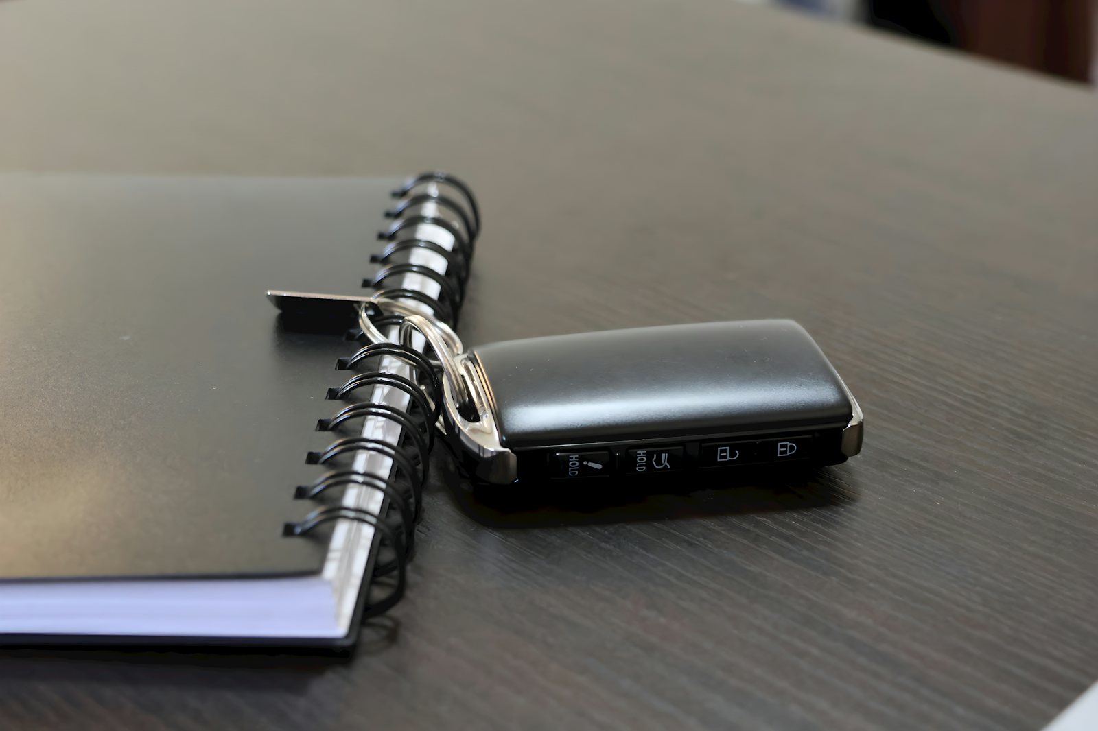Car key beside finance paperwork