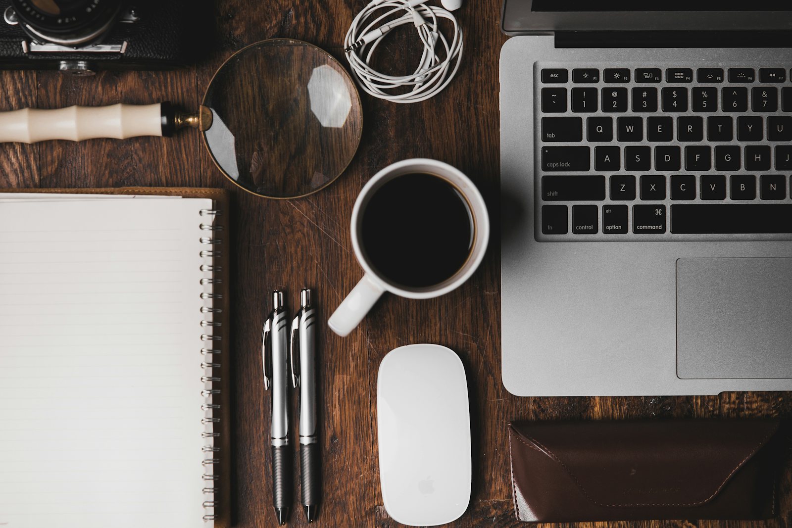 Laptop and coffee on a financial planning desk