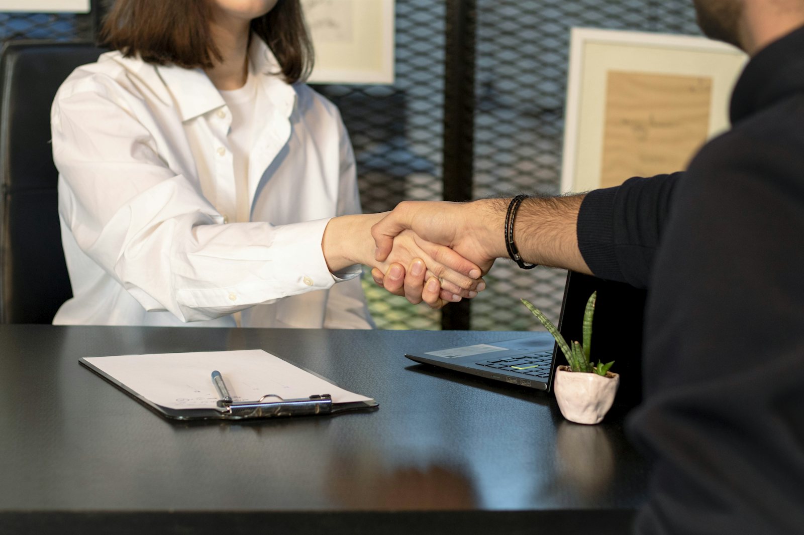 Adviser and client shaking hands