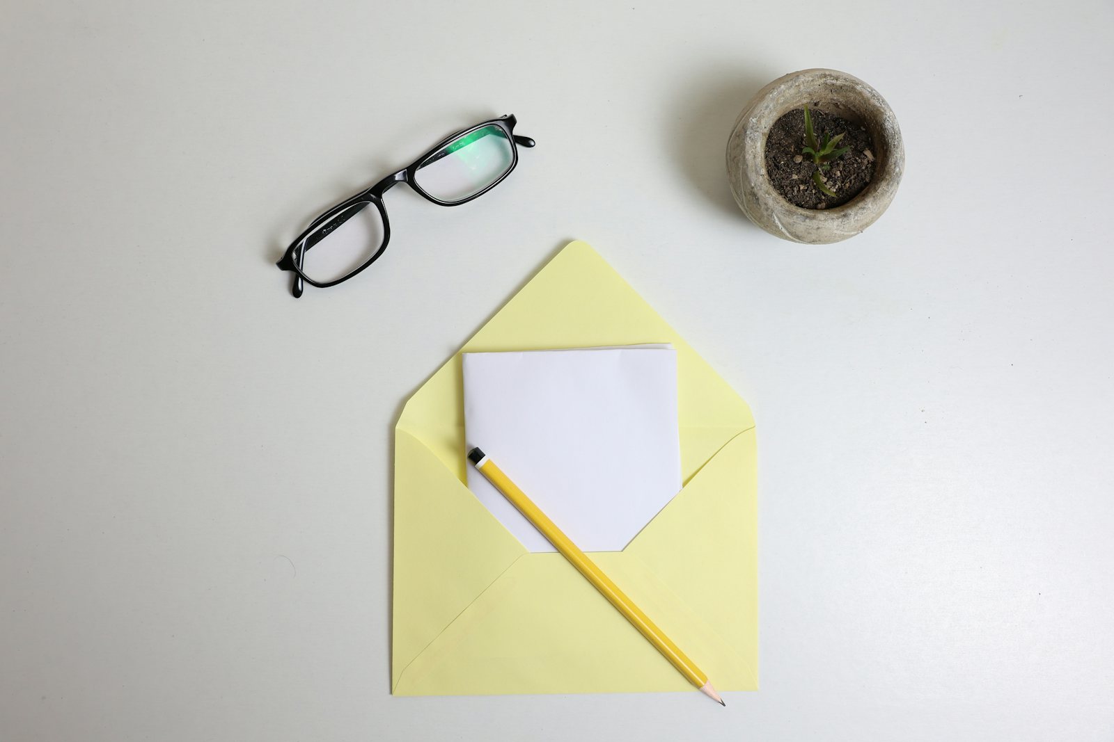 Glasses and pencil on financial paperwork
