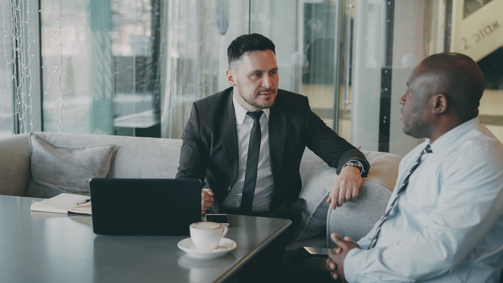 Consultation between two people at a desk
