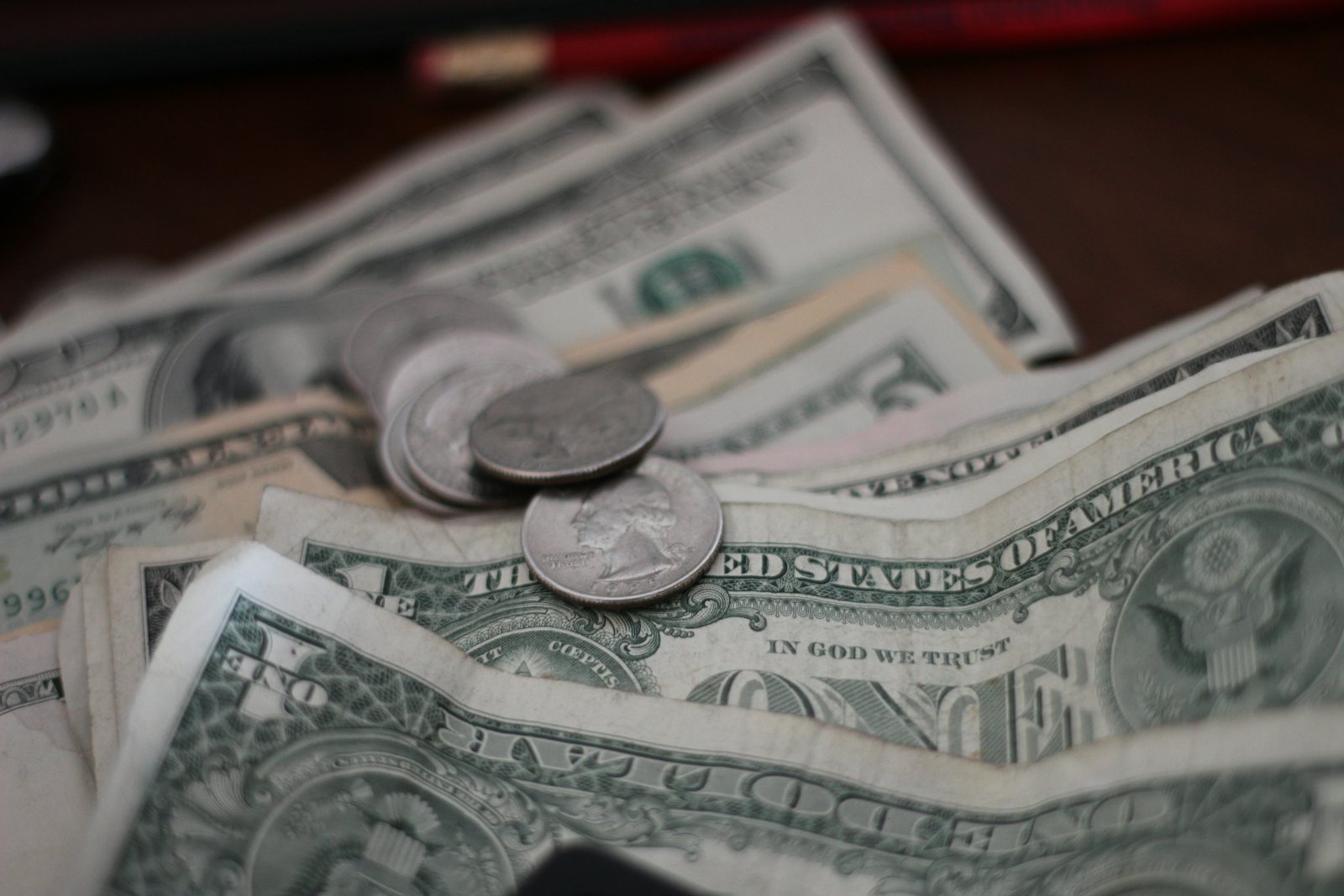 Coins and notes on a desk